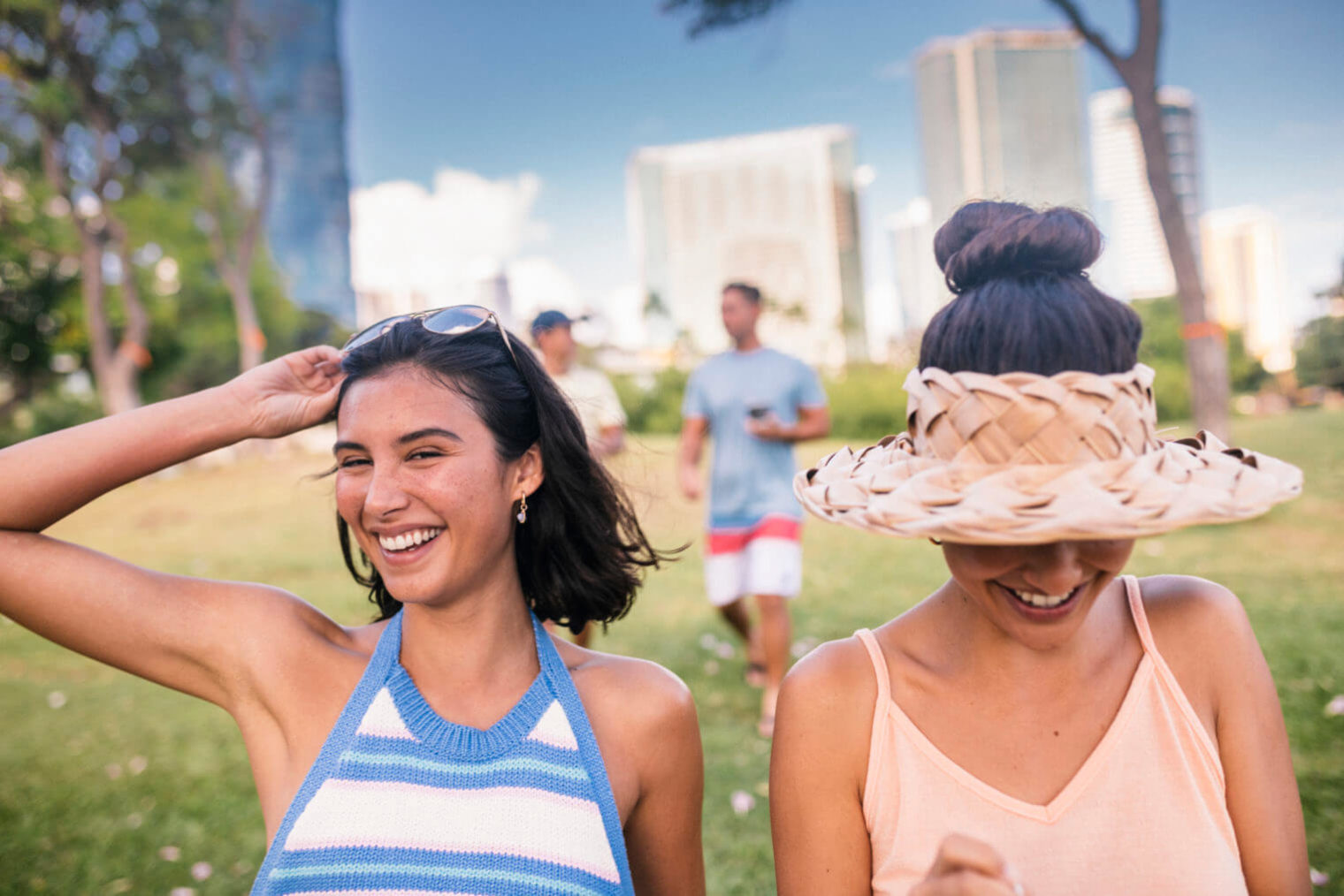 Two women smiling in a park