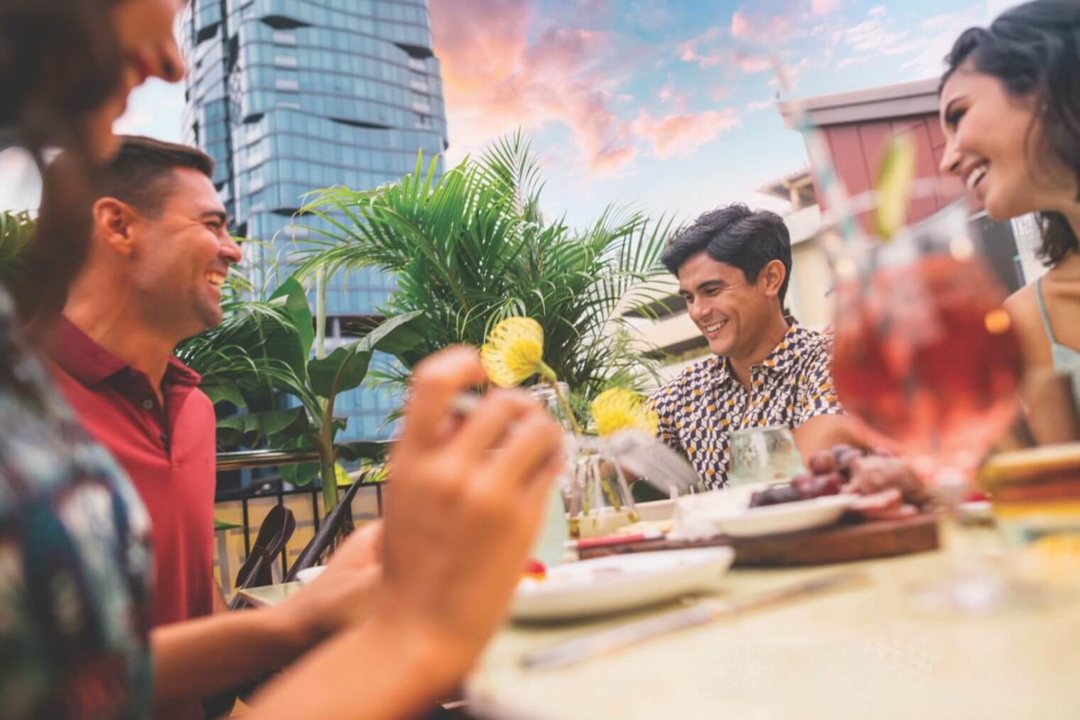 A group of people eating and drinking